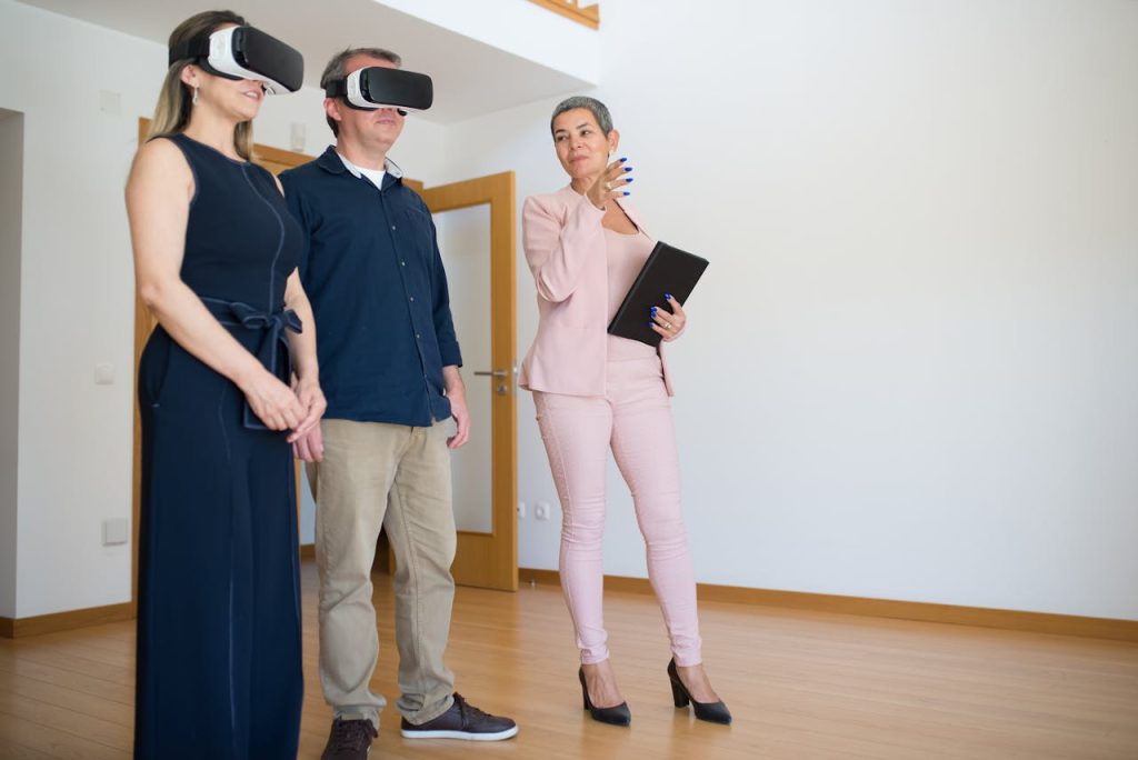 Real estate agent showing buyers property using Virtual reality (VR)