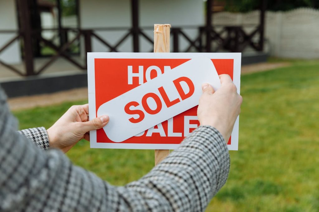 A "home for sale" sign on a property