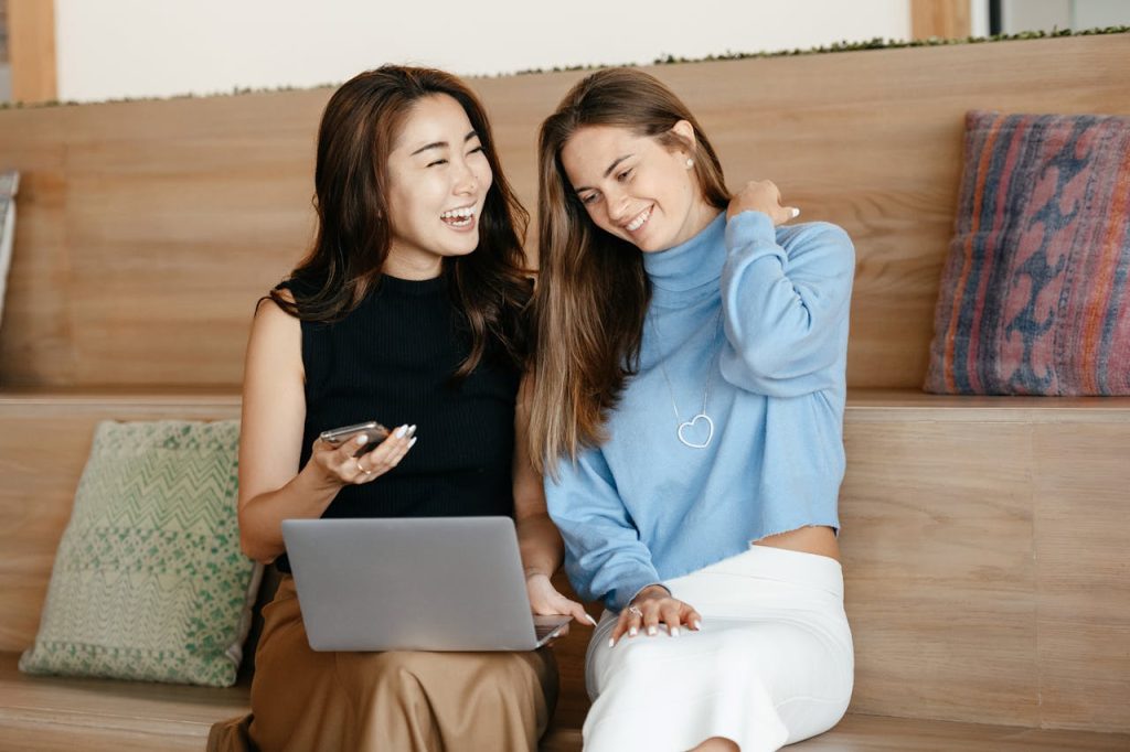 Real estate agents using a laptop